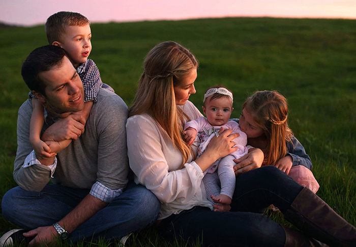 A tender family moment at sunset